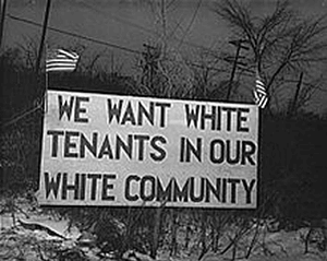 "We want white tenants in our white community" (sign)